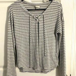 Brand new sweater. It runs baggy. It can fit a medium sized person